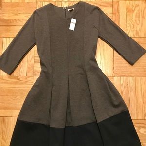 Flattering tea length dress.